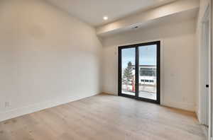 three bedrooms lower level featuring light wood-type flooring and recessed lighting, jack & jill bathrooms