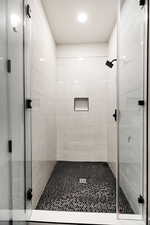 bathroom featuring a shower stall. Jack & Jill bathrooms on level 1