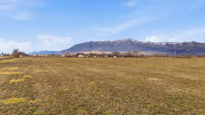 View of mountain backdrop featuring rural landscape