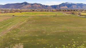 View of mountain backdrop with rural landscape