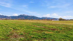 View of mountain backdrop featuring rural landscape