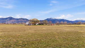 View of mountain backdrop featuring rural landscape