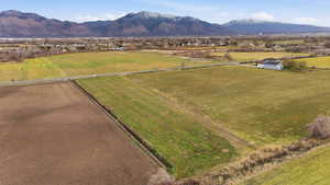 Overview of rural landscape with a mountain backdrop and abundant farmland