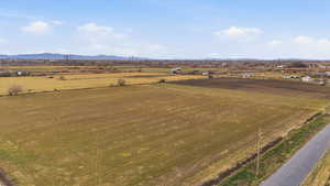Overview of rural landscape featuring a mountainous background