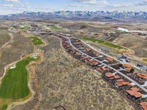 Aerial view of property's location with a mountainous background
