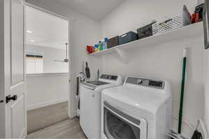 Laundry room featuring independent washer and dryer, recessed lighting, ceiling fan, and light carpet