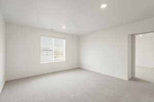 **DISCLAIMER** Interior colors & finishes may vary.Empty room featuring light colored carpet and recessed lighting