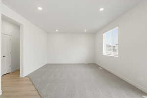 **DISCLAIMER** Interior colors & finishes may vary.Unfurnished room featuring recessed lighting and light wood-type flooring