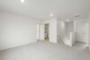 **DISCLAIMER** Interior colors & finishes may vary.Unfurnished room featuring recessed lighting and light colored carpet