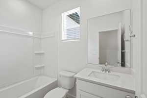 Bathroom with vanity and tub / shower combination