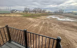 View of yard with a balcony and a residential view