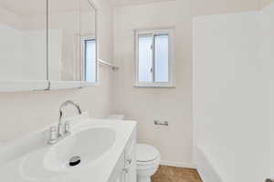 Full bath with vanity, shower / tub combination, and light tile patterned flooring