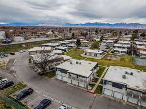 Aerial perspective of suburban area featuring a mountainous background