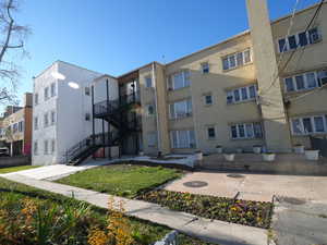 View of apartment building / complex with stairway