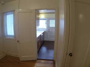 Apt # 4 >  Bathroom with dark wood-type flooring, vanity, and crown molding