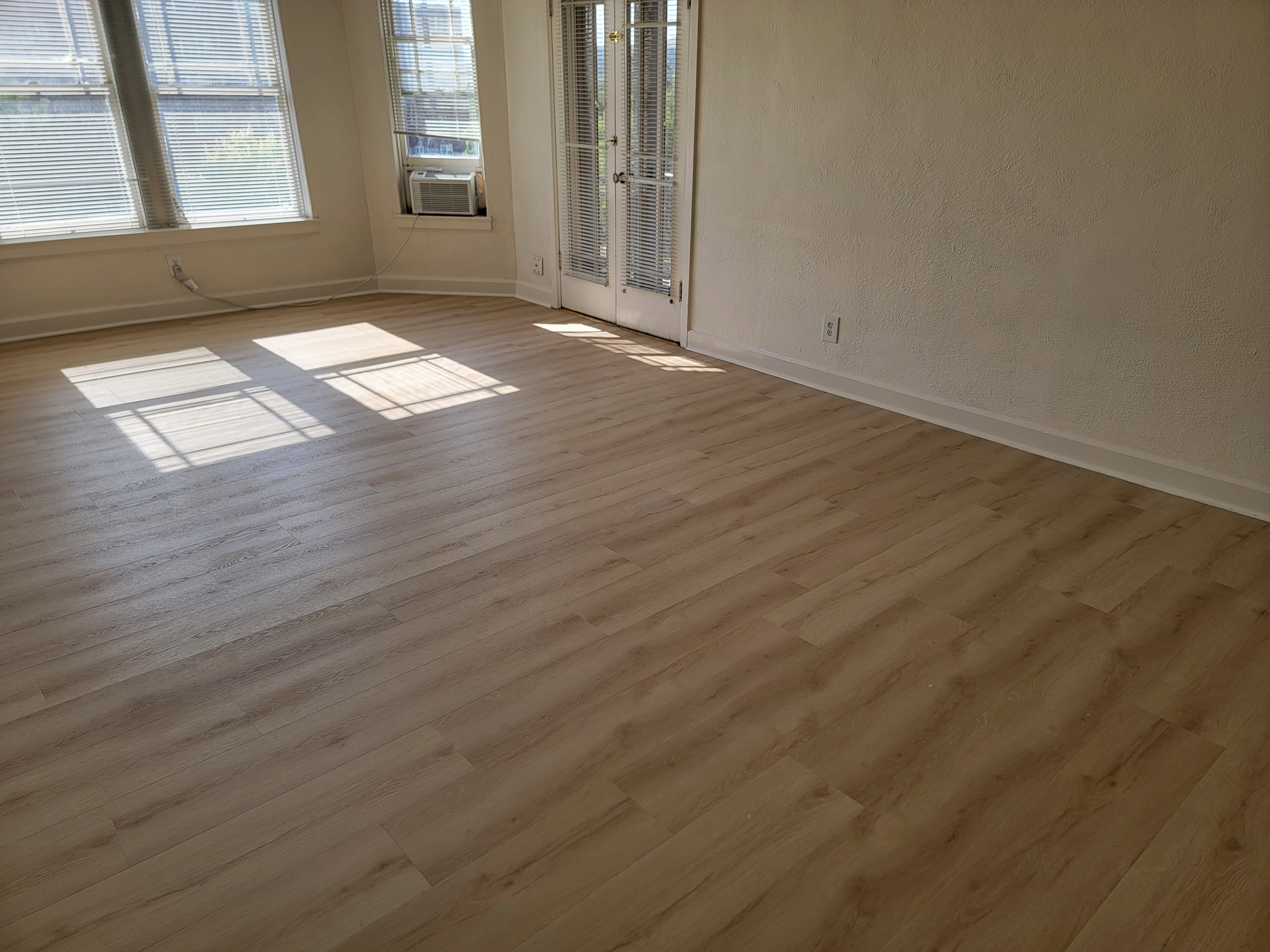Apt # 9 >  Empty room with wood finished floors and baseboards