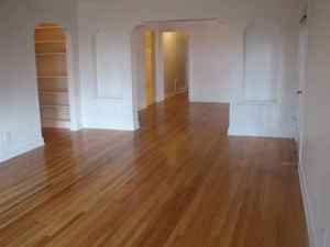 Apt # 12 >Spare room featuring dark wood finished floors