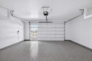 Garage with Epoxy Floors and Built-in Overhead Storage
