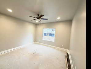 Empty room featuring recessed lighting and ceiling fan