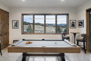 Recreation room featuring plenty of natural light and billiards table