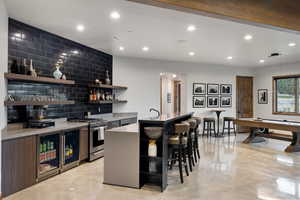 Indoor wet bar featuring pool table, open shelves, pendant lighting, beverage cooler, and recessed lighting