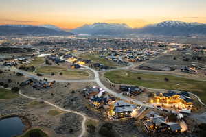 Aerial overview of property's location with mountains and nearby suburban area