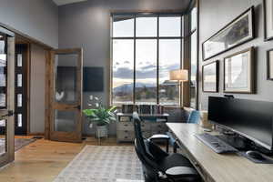 Office space featuring plenty of natural light and light wood-type flooring
