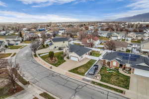 Aerial perspective of suburban area with a mountain backdrop