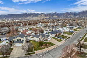 Aerial view of residential area featuring a mountain backdrop