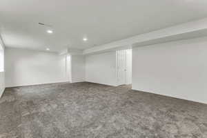 Finished basement featuring recessed lighting and carpet flooring