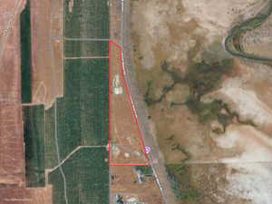 Aerial map of property and surrounding area featuring property parcel outlined