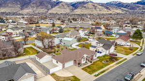 Aerial perspective of suburban area with a mountain backdrop