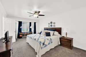 Owner's suite - Bedroom new carpet flooring, crown molding, and a ceiling fan