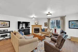 Family room featuring a fireplace and LVP floors
