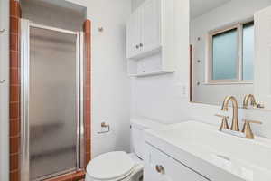 Primary Bedroom Bathroom with Shower, a New Vanity, & New Lighting