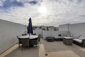 View of patio with outdoor dining space and outdoor lounge area
