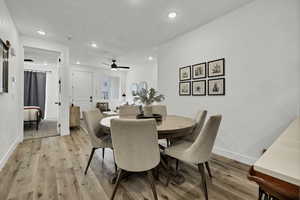 Dining area with light wood-type flooring, recessed lighting, and ceiling fan