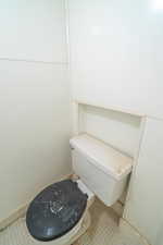 Toilet sits in shower of bonus room