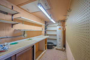 Storage area with electric water heater
