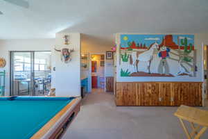 Primary bedoom with office behind sliding glass doors on left and primary bathroom straight ahead.