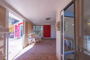 Sunroom featuring a screened patio area