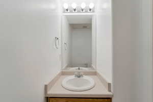 Bathroom featuring vanity and toilet