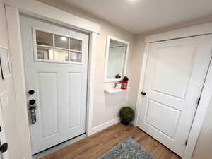 Bathroom featuring wood finished floors and baseboards