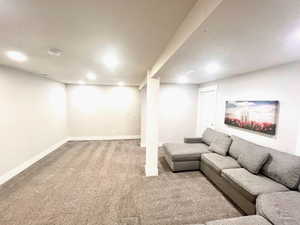 Living room with carpet flooring and recessed lighting