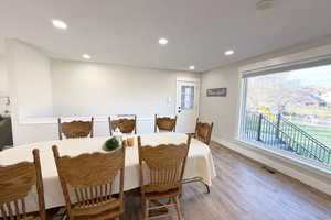 Dining area featuring recessed lighting and wood finished floors