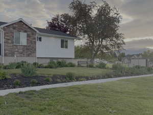 View of property exterior featuring stone siding and board and batten siding