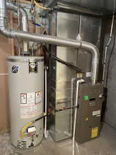 Utilities featuring water heater and heating unit