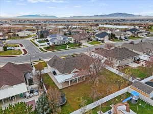 Aerial perspective of suburban area featuring a mountain backdrop