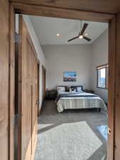 Bedroom featuring carpet, a ceiling fan, high vaulted ceiling, and recessed lighting