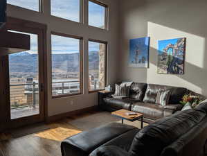 Living room with hardwood / wood-style flooring and a mountain view